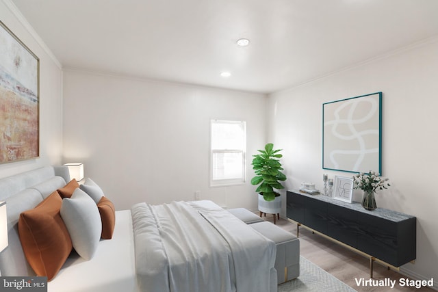bedroom with ornamental molding, recessed lighting, and wood finished floors