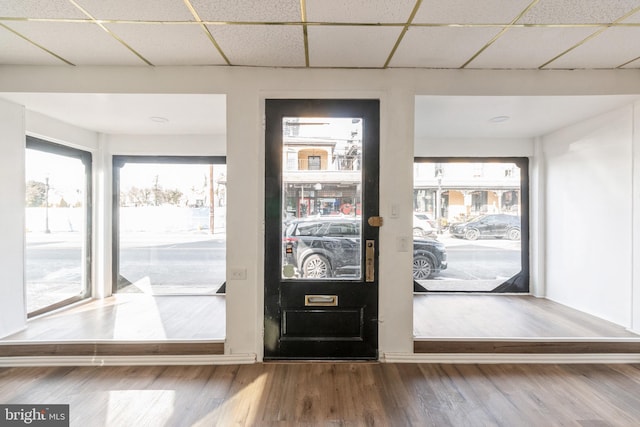 foyer featuring a paneled ceiling and wood finished floors