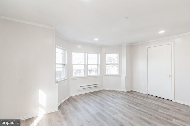interior space with a baseboard radiator, ornamental molding, and plenty of natural light