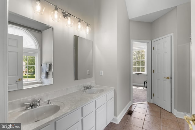 145 Rolling Ave, North East, MD 21901 - full bathroom with plenty of natural light, baseboards, tile patterned flooring, and double vanity