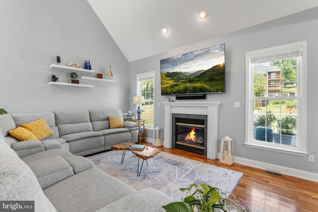 145 Rolling Ave, North East, MD 21901 - living room featuring wood finished floors, high vaulted ceiling, a fireplace, baseboards, and recessed lighting
