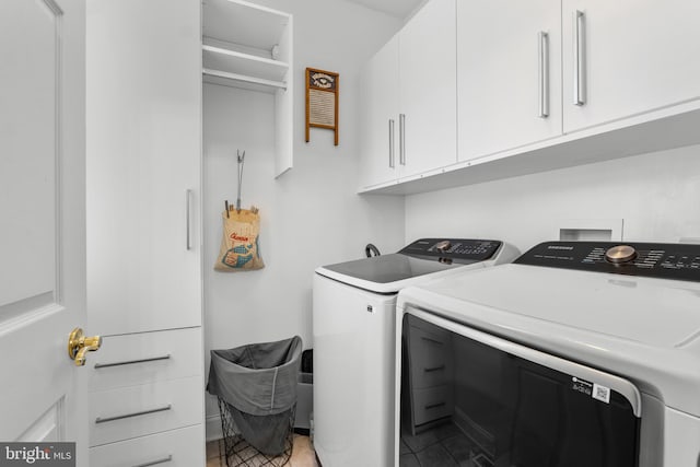 145 Rolling Ave, North East, MD 21901 - laundry room featuring separate washer and dryer, cabinet space, and light tile patterned floors
