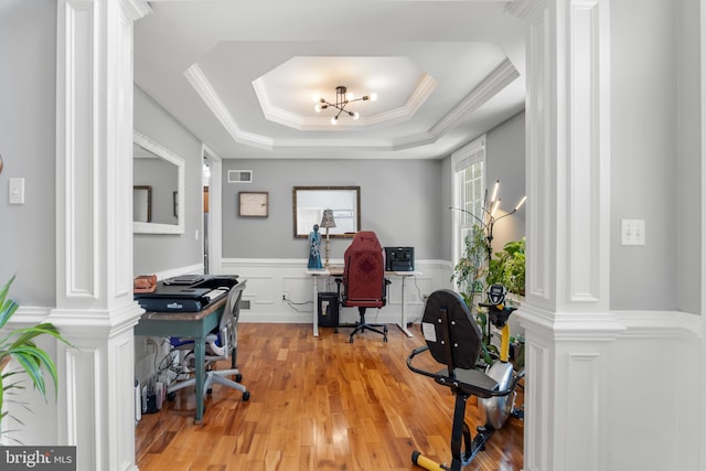 145 Rolling Ave, North East, MD 21901 - office space featuring ornate columns, light wood-type flooring, a tray ceiling, a decorative wall, and a wainscoted wall
