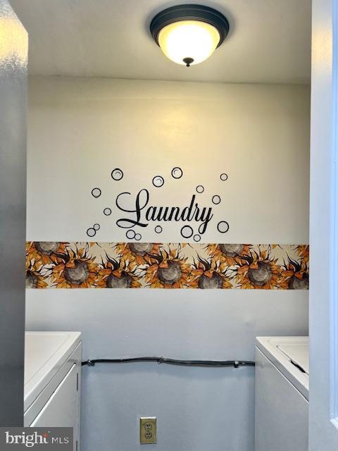 laundry area featuring independent washer and dryer and laundry area