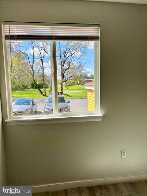 interior details with wood finished floors and baseboards
