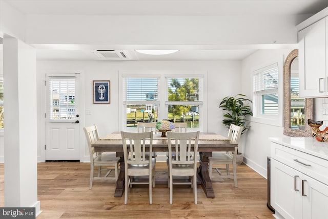 12353 Meadow Dr, Berlin, MD 21811 - dining room featuring visible vents, baseboards, and light wood finished floors