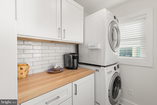 12353 Meadow Dr, Berlin, MD 21811 - clothes washing area with stacked washer and dryer and cabinet space