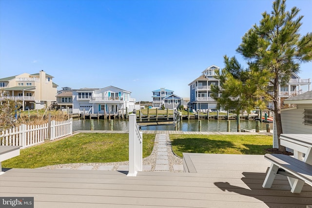 12353 Meadow Dr, Berlin, MD 21811 - view of dock with a water view, a residential view, fence, and a yard