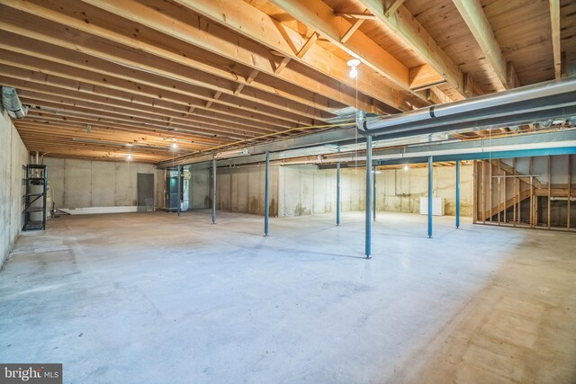 unfinished below grade area featuring heating unit