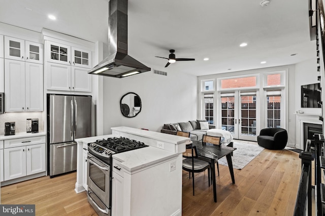 929 S 2nd St, Philadelphia, PA 19147 - kitchen with stainless steel appliances, ventilation hood, open floor plan, light wood finished floors, and recessed lighting