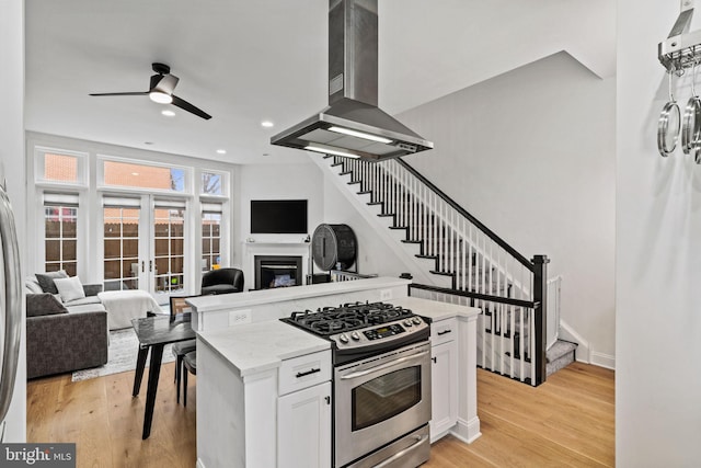 929 S 2nd St, Philadelphia, PA 19147 - kitchen featuring stainless steel range with gas stovetop, open floor plan, ceiling fan, range hood, and recessed lighting