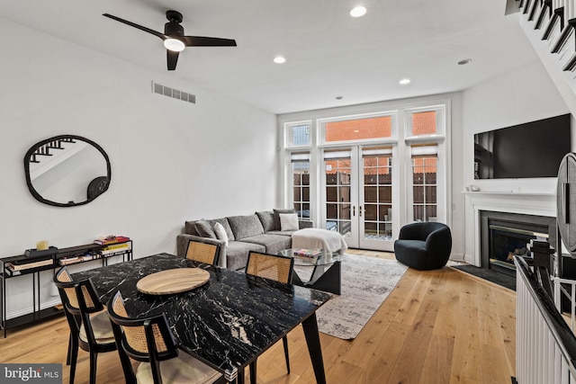 929 S 2nd St, Philadelphia, PA 19147 - living room with light wood-style flooring, french doors, ceiling fan, a glass covered fireplace, and recessed lighting