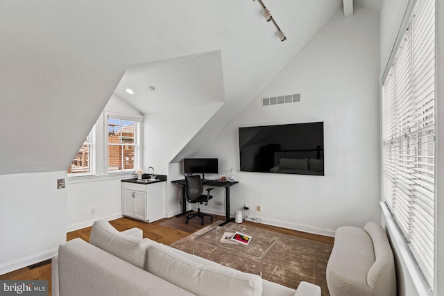 929 S 2nd St, Philadelphia, PA 19147 - living area featuring lofted ceiling, wood finished floors, a desk, baseboards, and rail lighting