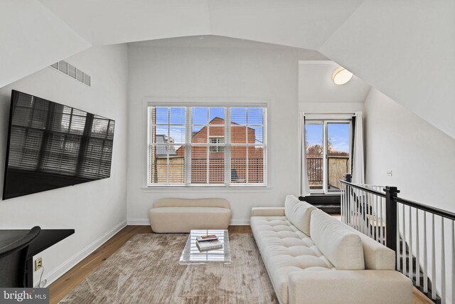 929 S 2nd St, Philadelphia, PA 19147 - living room featuring wood finished floors, lofted ceiling, and baseboards