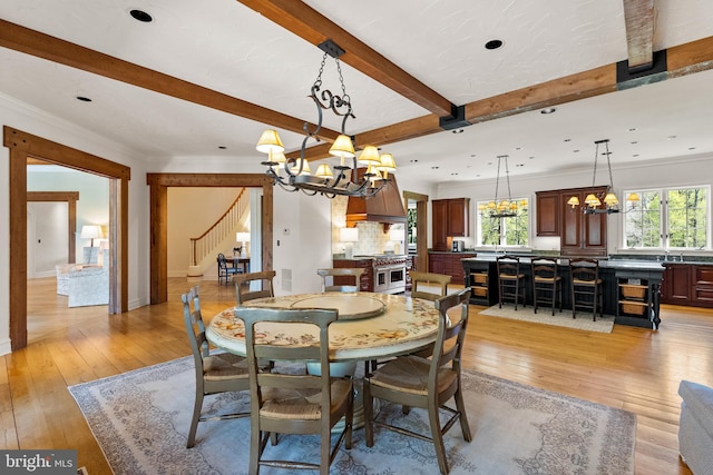 dining area featuring stairs, beam ceiling, light wood finished floors, a notable chandelier, and recessed lighting