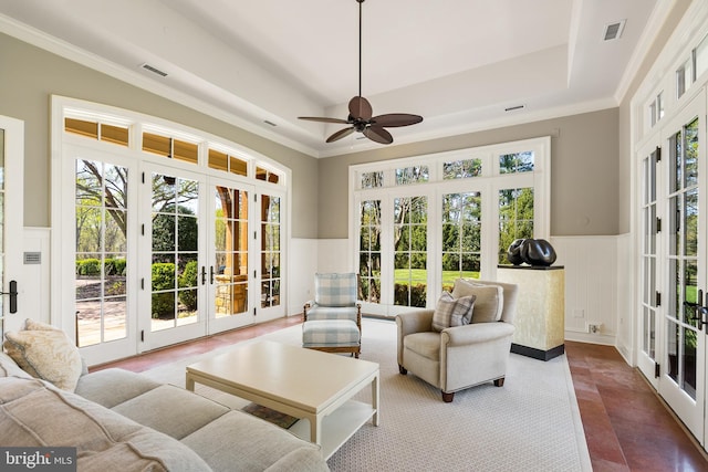 sunroom / solarium featuring french doors, visible vents, and a wealth of natural light