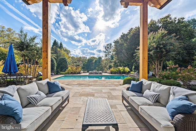 view of patio featuring an outdoor pool and an outdoor hangout area