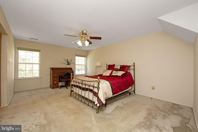 bedroom with visible vents, a ceiling fan, and carpet flooring