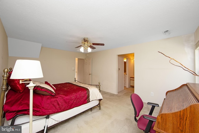 bedroom with a ceiling fan and light colored carpet