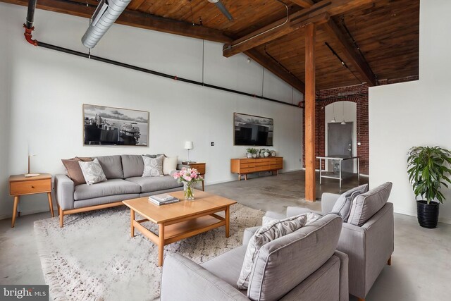 1714 Memphis St Unit 402, Philadelphia, PA 19125 - living area with wood ceiling, finished concrete floors, beamed ceiling, and high vaulted ceiling