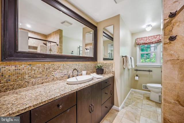 9127 Friars Rd, Bethesda, MD 20817 - bathroom with vanity, tasteful backsplash, baseboards, toilet, and a tile shower