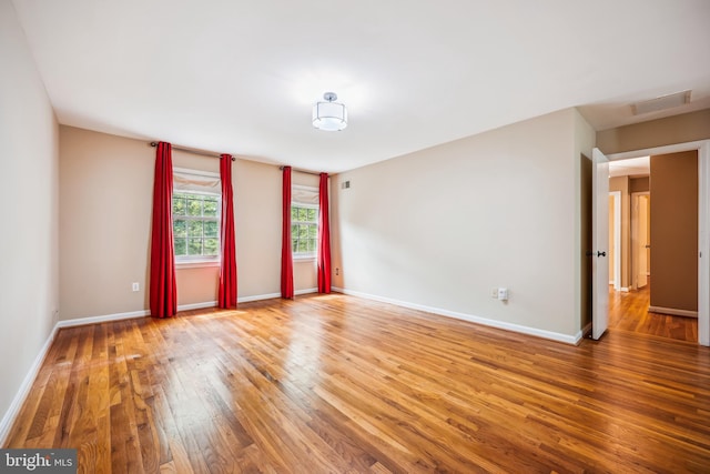 9127 Friars Rd, Bethesda, MD 20817 - empty room with hardwood / wood-style floors and baseboards