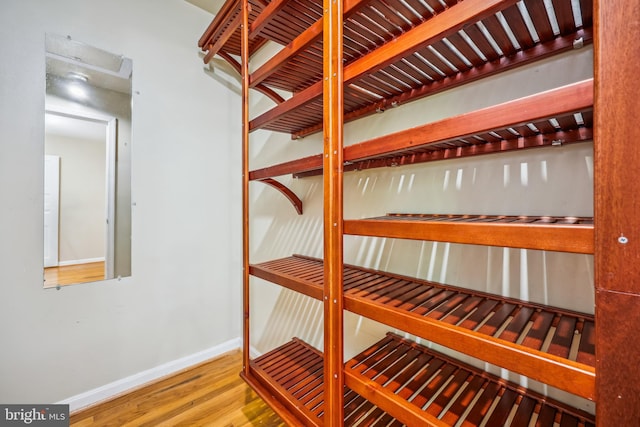 9127 Friars Rd, Bethesda, MD 20817 - wine area with wood finished floors and baseboards