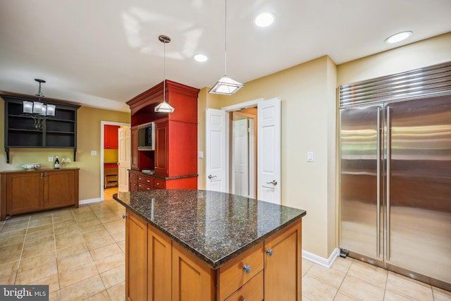 9127 Friars Rd, Bethesda, MD 20817 - kitchen with stainless steel built in refrigerator, open shelves, baseboards, light tile patterned floors, and recessed lighting