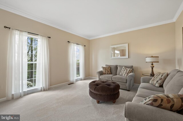 carpeted living area featuring visible vents, crown molding, and baseboards