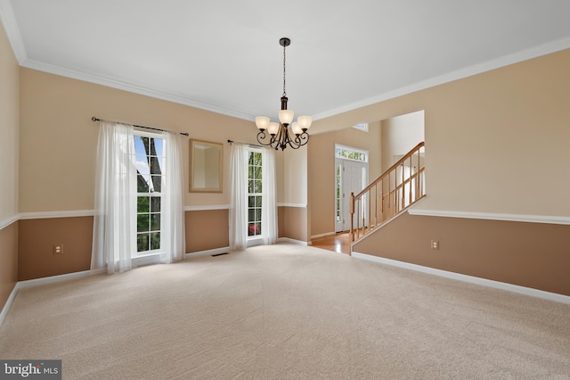 carpeted empty room with crown molding, stairs, a notable chandelier, and baseboards