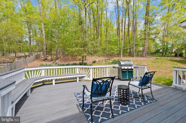 wooden terrace with a grill