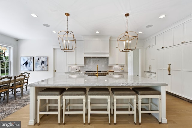 9850 Jerry Ln, Vienna, VA 22180 - kitchen with a chandelier, decorative backsplash, recessed lighting, and white cabinetry