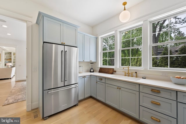9850 Jerry Ln, Vienna, VA 22180 - kitchen featuring high quality fridge, a sink, gray cabinets, light wood-style flooring, and recessed lighting