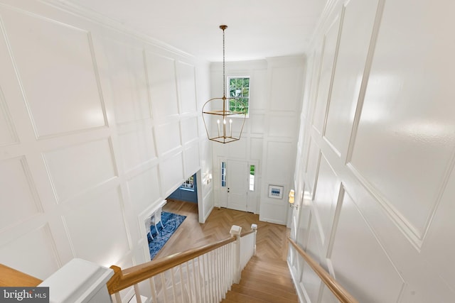 9850 Jerry Ln, Vienna, VA 22180 - stairway featuring a decorative wall and a chandelier