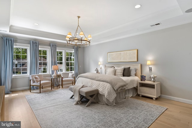 9850 Jerry Ln, Vienna, VA 22180 - bedroom with a tray ceiling, a chandelier, baseboards, ornamental molding, and light wood-style flooring