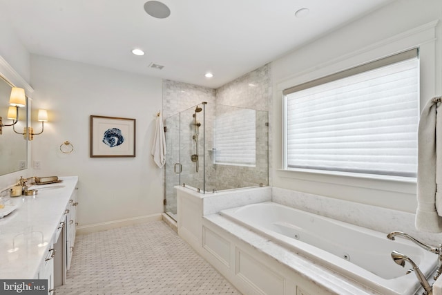 9850 Jerry Ln, Vienna, VA 22180 - bathroom featuring vanity, a stall shower, a tub with jets, and recessed lighting