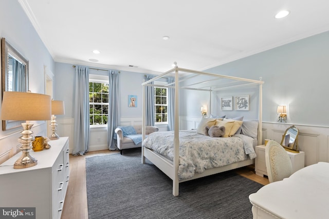 9850 Jerry Ln, Vienna, VA 22180 - bedroom with wood finished floors, ornamental molding, a wainscoted wall, recessed lighting, and a decorative wall