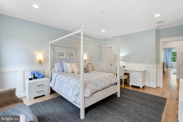 9850 Jerry Ln, Vienna, VA 22180 - bedroom featuring ornamental molding, a wainscoted wall, light wood-style flooring, a decorative wall, and recessed lighting