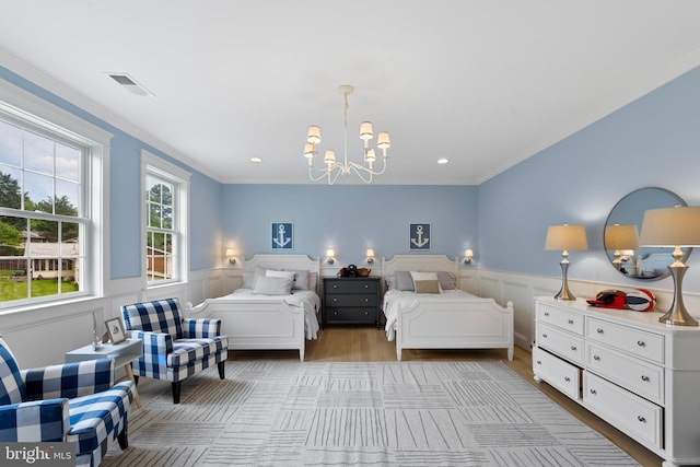9850 Jerry Ln, Vienna, VA 22180 - bedroom with a chandelier, light wood-style floors, a wainscoted wall, ornamental molding, and recessed lighting