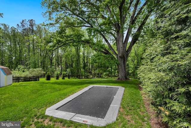 9850 Jerry Ln, Vienna, VA 22180 - view of yard with a storage unit and an outbuilding