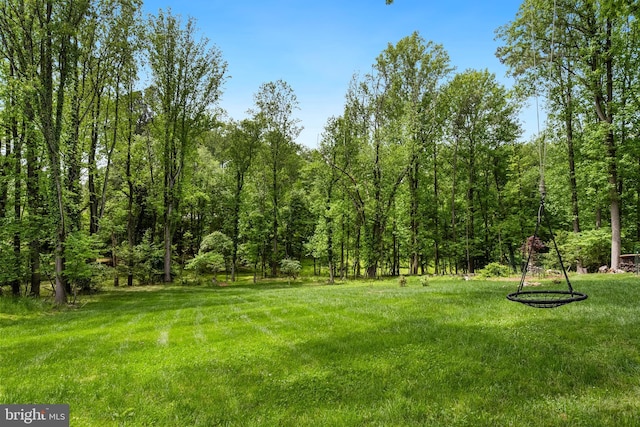 9850 Jerry Ln, Vienna, VA 22180 - view of grassy yard with a forest view