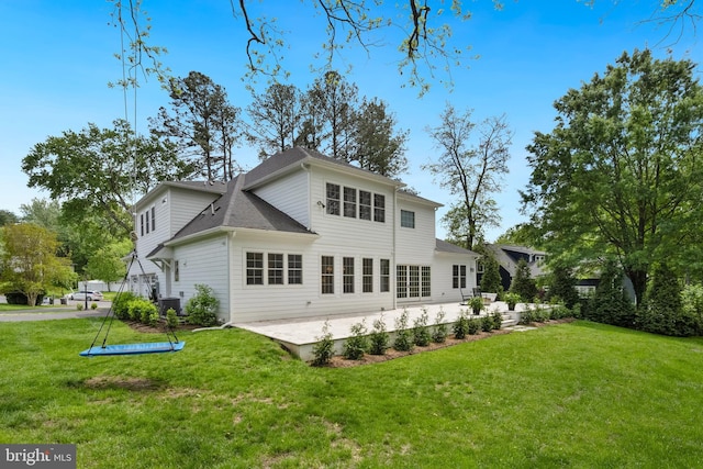 9850 Jerry Ln, Vienna, VA 22180 - back of property featuring a lawn and a patio