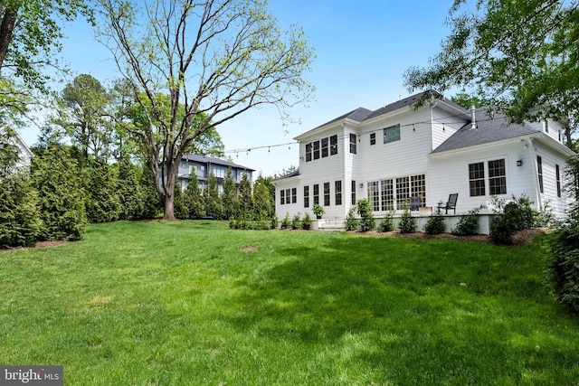 9850 Jerry Ln, Vienna, VA 22180 - rear view of property with a yard