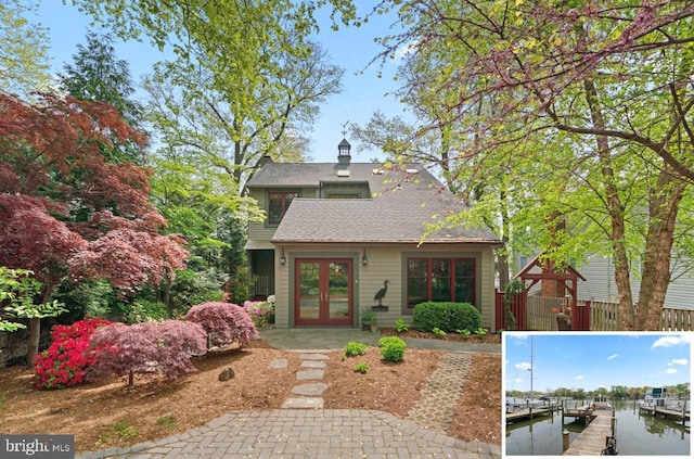 735 Dividing Rd, Severna Park, MD 21146 - view of front of house featuring a boat dock, a water view, roof with shingles, fence, and french doors