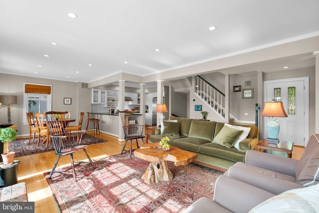 735 Dividing Rd, Severna Park, MD 21146 - living room with recessed lighting, stairway, decorative columns, ornamental molding, and wood finished floors
