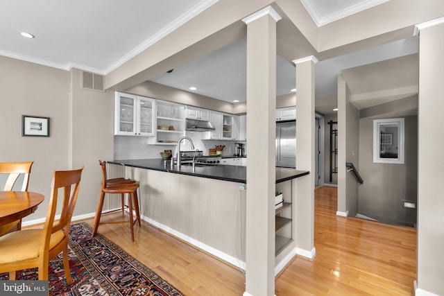 735 Dividing Rd, Severna Park, MD 21146 - kitchen with a sink, light wood-style floors, open shelves, stainless steel built in refrigerator, and dark countertops