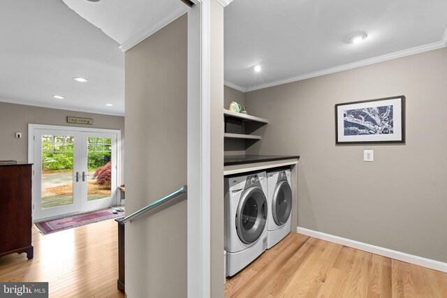 735 Dividing Rd, Severna Park, MD 21146 - laundry room featuring baseboards, ornamental molding, washing machine and clothes dryer, and light wood-style flooring