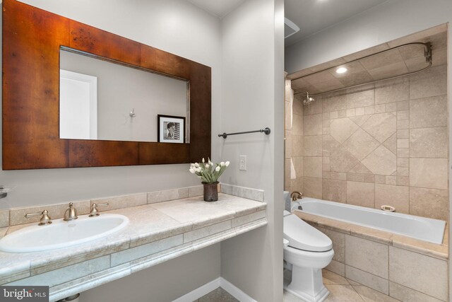 735 Dividing Rd, Severna Park, MD 21146 - full bath with tile patterned floors, tiled shower / bath combo, toilet, and vanity
