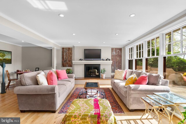 735 Dividing Rd, Severna Park, MD 21146 - living area featuring crown molding, recessed lighting, wood finished floors, and a glass covered fireplace