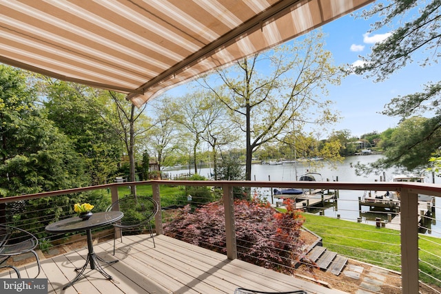 735 Dividing Rd, Severna Park, MD 21146 - wooden deck featuring boat lift, a dock, a yard, and a water view